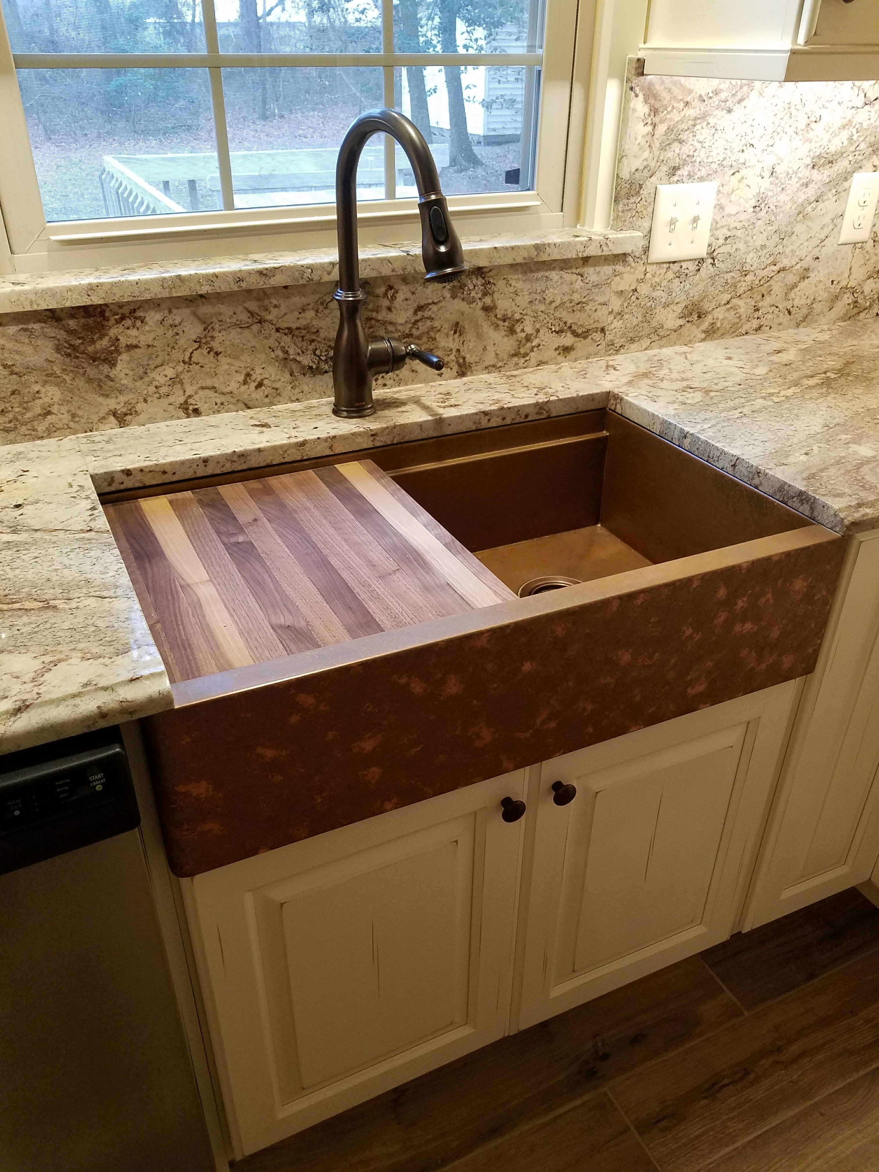 flush copper sink in granite top