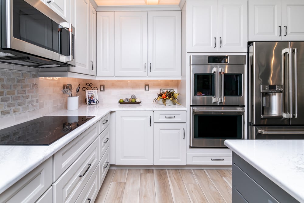 all white kitchen with induction cook top